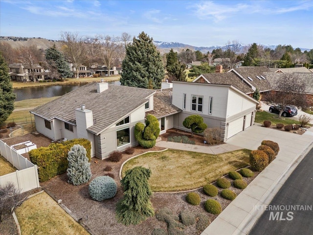 bird's eye view featuring a residential view and a water view