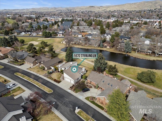 bird's eye view featuring a residential view and a water view