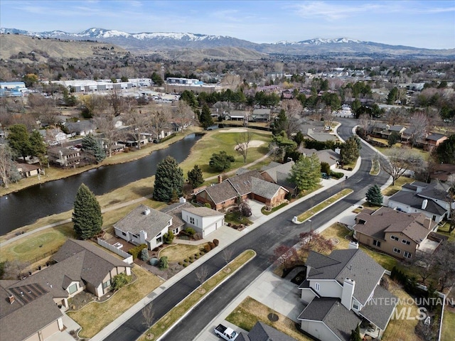 bird's eye view featuring a residential view and a water and mountain view