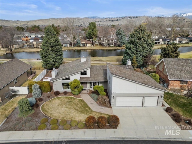 aerial view featuring a residential view and a water view