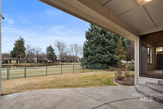 view of yard with a patio and fence