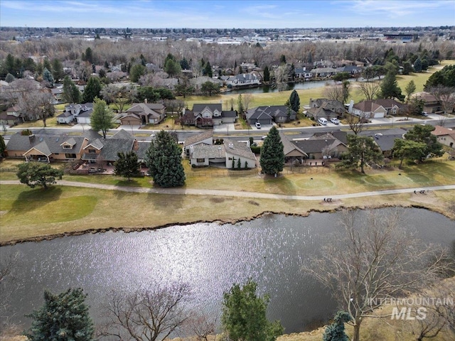 bird's eye view with a residential view and a water view