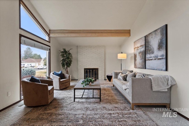 living area with baseboards, carpet floors, a fireplace, and vaulted ceiling with beams