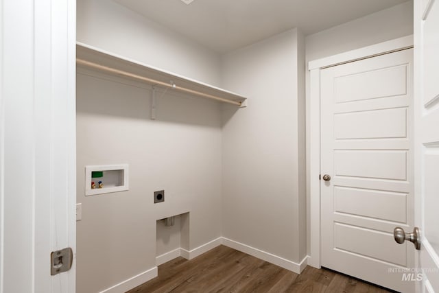 clothes washing area featuring laundry area, baseboards, dark wood finished floors, hookup for a washing machine, and hookup for an electric dryer