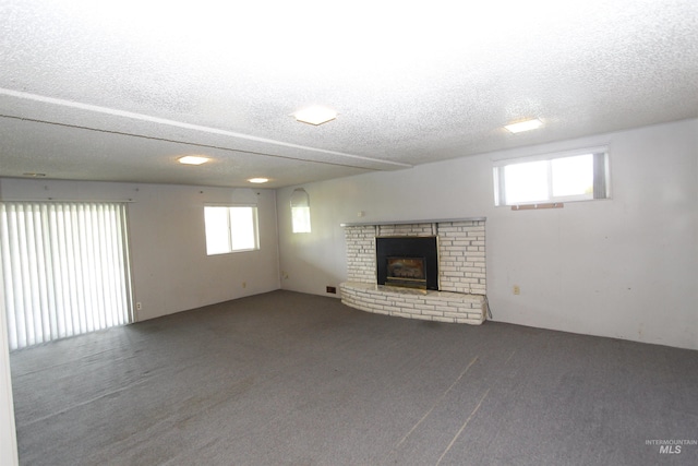930 Coulter Ln, Clarkston, WA 99403 - unfurnished living room featuring a textured ceiling, carpet floors, and a fireplace