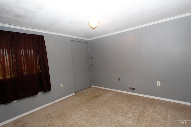 carpeted empty room with ornamental molding