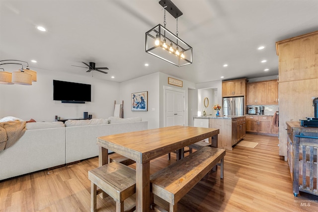 dining area featuring light hardwood / wood-style floors and ceiling fan