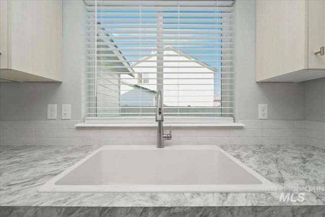 709 W Smoky Quartz St, Kuna, ID 83634 - kitchen view of a sink and light stone counters