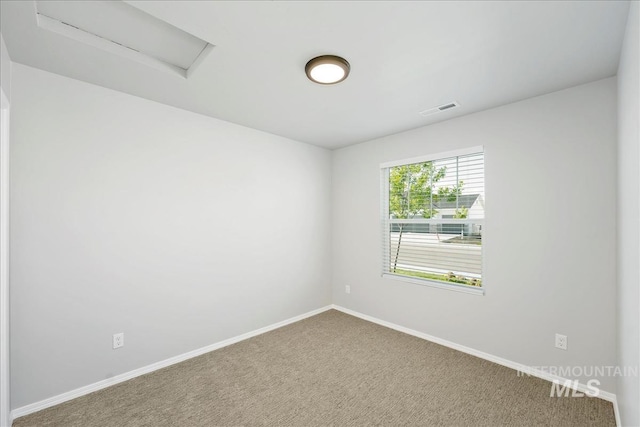 709 W Smoky Quartz St, Kuna, ID 83634 - unfurnished room featuring attic access, carpet flooring, and baseboards