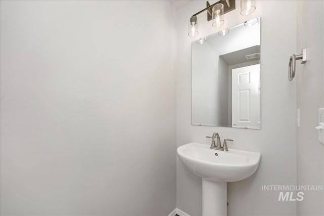 709 W Smoky Quartz St, Kuna, ID 83634 - bathroom with a sink and baseboards