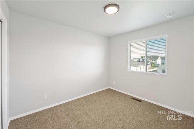 709 W Smoky Quartz St, Kuna, ID 83634 - spare room featuring carpet and baseboards