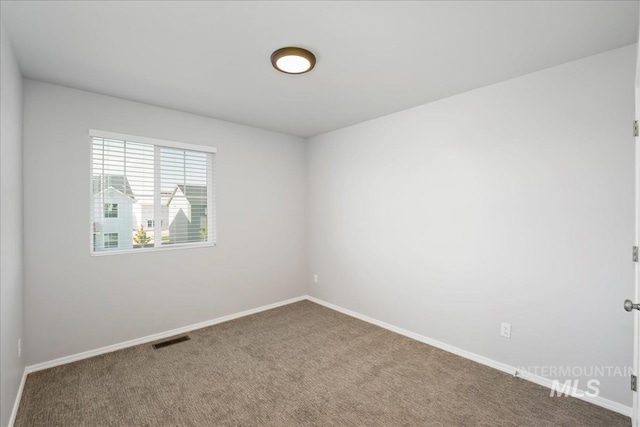 709 W Smoky Quartz St, Kuna, ID 83634 - spare room with carpet floors and baseboards