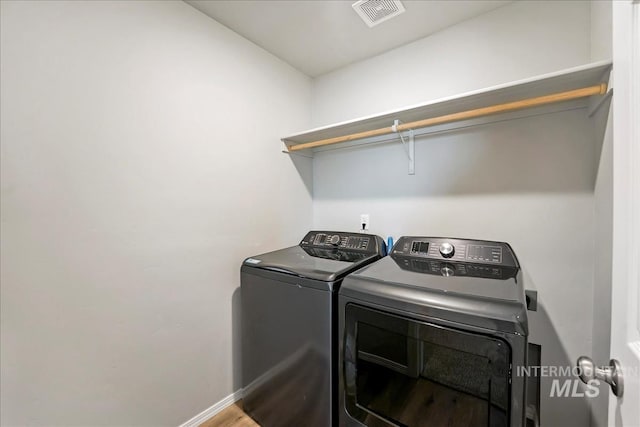 709 W Smoky Quartz St, Kuna, ID 83634 - washroom featuring washer and clothes dryer and baseboards