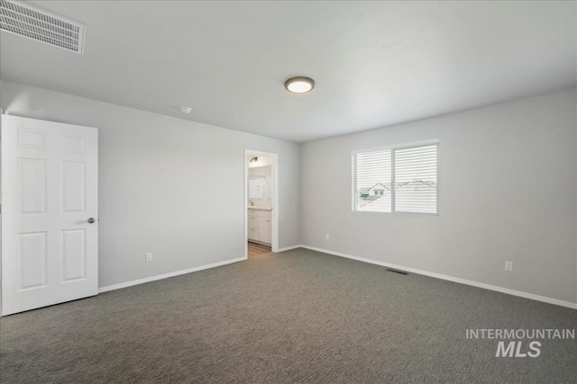 709 W Smoky Quartz St, Kuna, ID 83634 - unfurnished bedroom featuring baseboards, carpet, and ensuite bath
