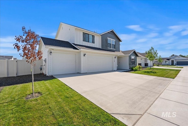 709 W Smoky Quartz St, Kuna, ID 83634 - view of front of property featuring an attached garage, driveway, and board and batten siding