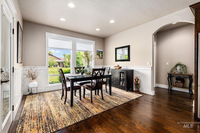 11714 W Pinewood River Ln, Star, ID 83669 - dining area with arched walkways, wood-type flooring, and recessed lighting