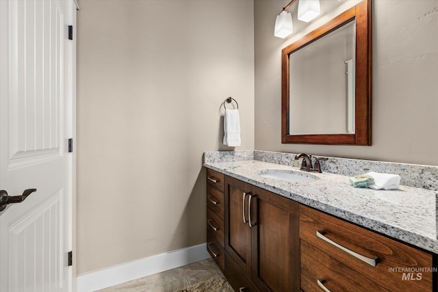 11714 W Pinewood River Ln, Star, ID 83669 - bathroom with vanity and baseboards