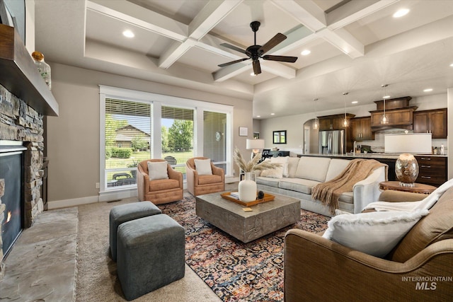 11714 W Pinewood River Ln, Star, ID 83669 - living area with coffered ceiling, ceiling fan, healthy amount of natural light, a fireplace, and recessed lighting