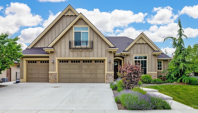 6859 N Topaz Jewel Pl, Meridian, ID 83646 - craftsman house featuring board and batten siding, stone siding, driveway, and a front lawn