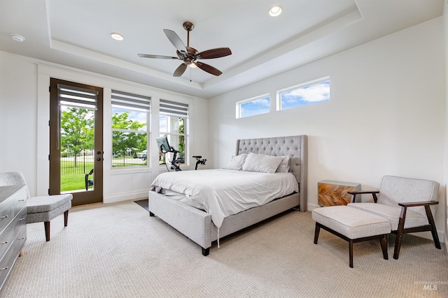6859 N Topaz Jewel Pl, Meridian, ID 83646 - carpeted bedroom with a tray ceiling, access to exterior, recessed lighting, and a ceiling fan