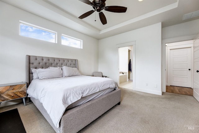 6859 N Topaz Jewel Pl, Meridian, ID 83646 - bedroom featuring a raised ceiling, carpet, baseboards, ensuite bathroom, and ceiling fan