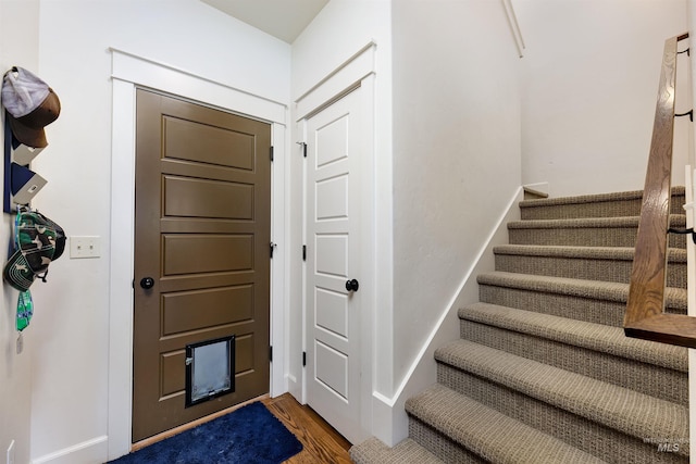 6859 N Topaz Jewel Pl, Meridian, ID 83646 - entrance foyer featuring stairway, wood finished floors, and baseboards