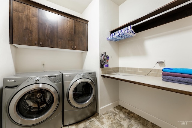 6859 N Topaz Jewel Pl, Meridian, ID 83646 - clothes washing area featuring cabinet space, washer and dryer, and baseboards