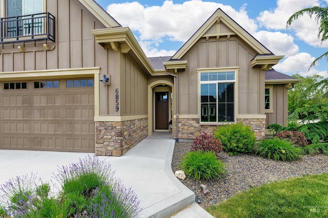6859 N Topaz Jewel Pl, Meridian, ID 83646 - craftsman house featuring stone siding, board and batten siding, a balcony, concrete driveway, and roof with shingles