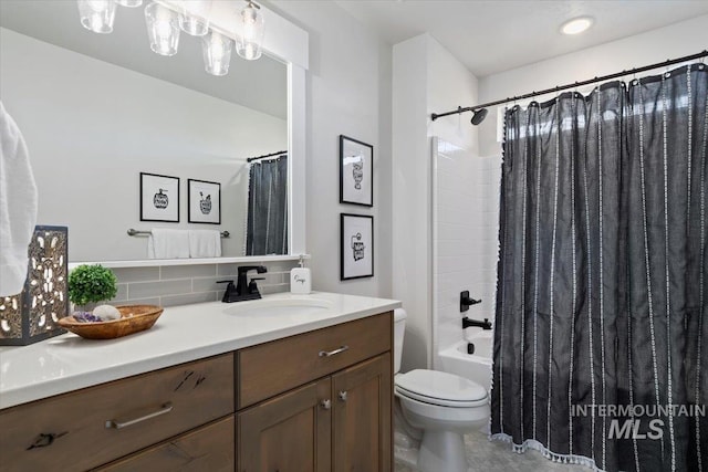 1867 W Wind Drift St, Meridian, ID 83646 - bathroom featuring decorative backsplash, vanity, toilet, and shower / bath combo with shower curtain