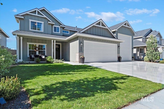 1867 W Wind Drift St, Meridian, ID 83646 - craftsman-style house featuring board and batten siding, a garage, concrete driveway, a front yard, and covered porch