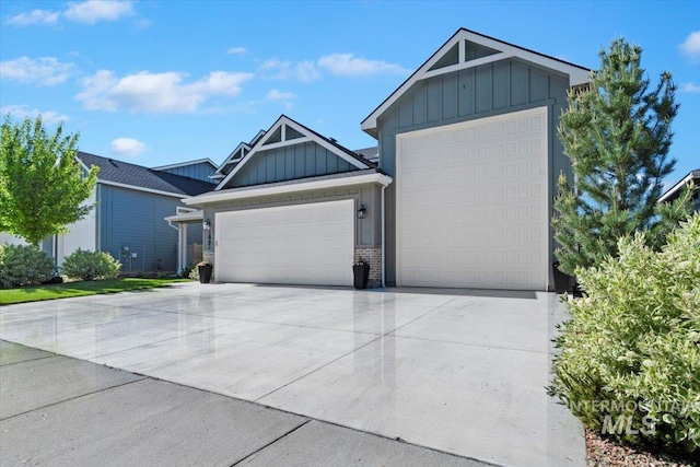 1867 W Wind Drift St, Meridian, ID 83646 - view of front of house with board and batten siding, an attached garage, driveway, and brick siding