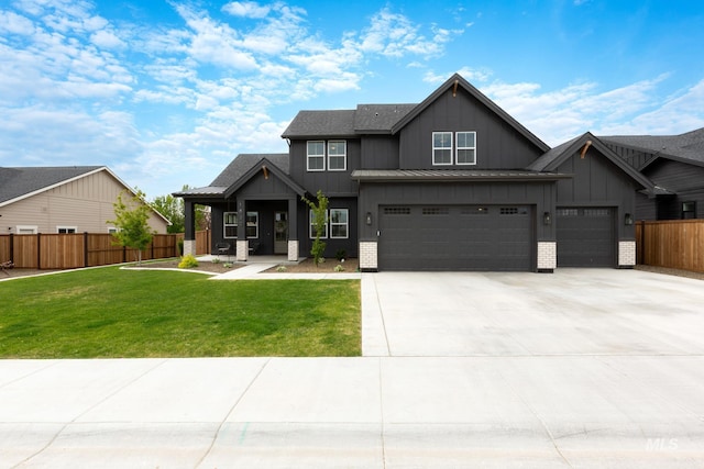 view of front facade featuring a front lawn and a garage