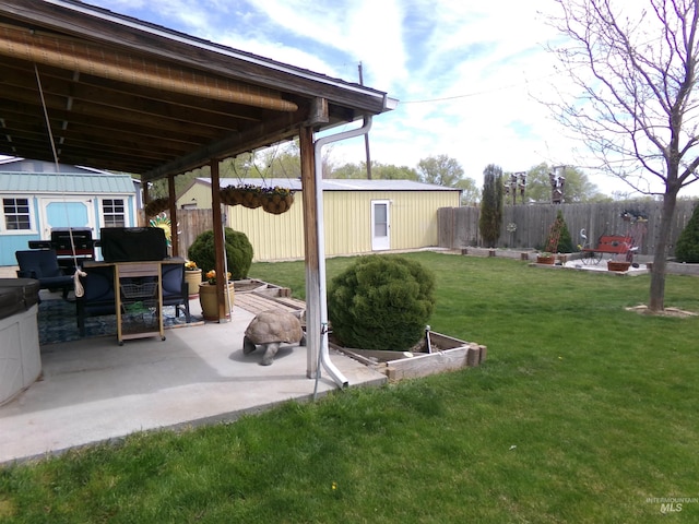 1835 Lincoln St, Mountain Home, ID 83647 - view of yard featuring an outdoor structure, a patio, and a fenced backyard