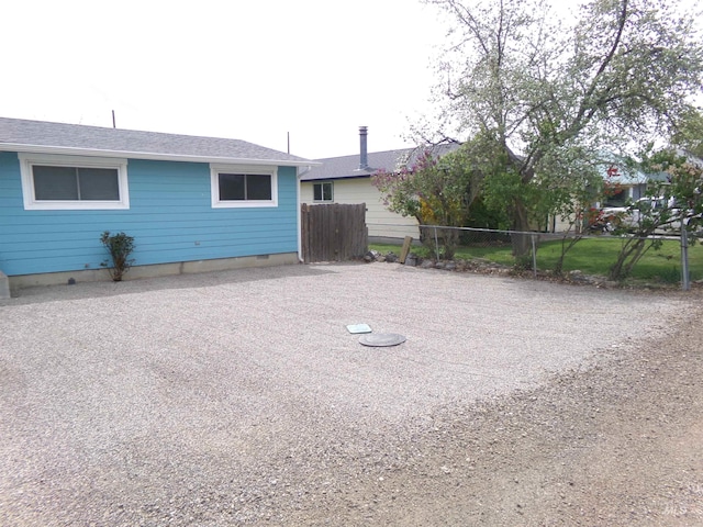 1835 Lincoln St, Mountain Home, ID 83647 - exterior space featuring fence and roof with shingles