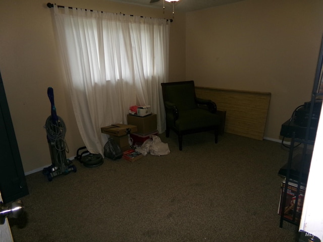 1835 Lincoln St, Mountain Home, ID 83647 - sitting room with carpet floors, a ceiling fan, and baseboards