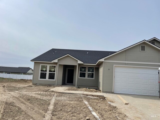 single story home with a garage