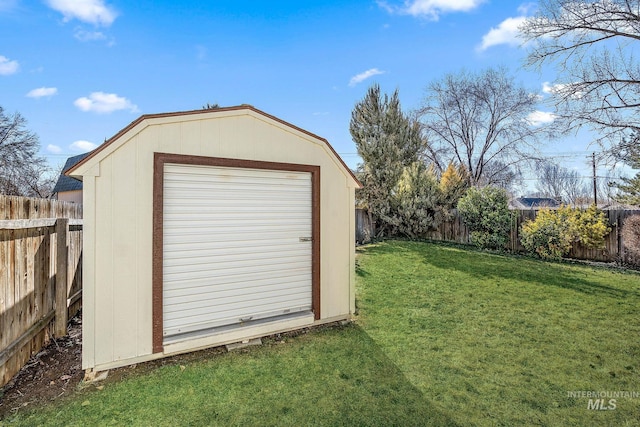 view of shed with a fenced backyard