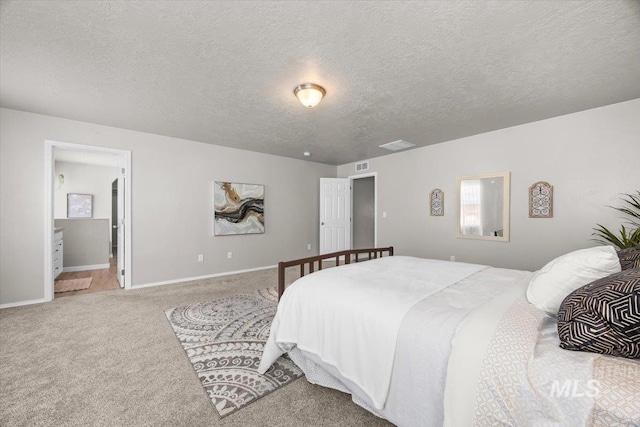 120 Pilgrim Way, Middleton, ID 83644 - bedroom with carpet floors, a textured ceiling, baseboards, and ensuite bath