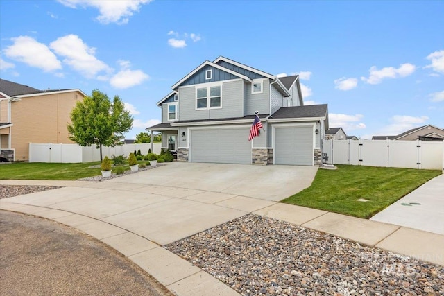 120 Pilgrim Way, Middleton, ID 83644 - craftsman house with a gate, board and batten siding, concrete driveway, stone siding, and an attached garage