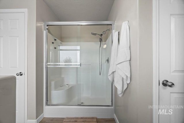 120 Pilgrim Way, Middleton, ID 83644 - full bath featuring baseboards, a shower stall, and a textured ceiling
