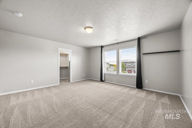 120 Pilgrim Way, Middleton, ID 83644 - unfurnished room with carpet floors, a textured ceiling, baseboards, and a smoke detector