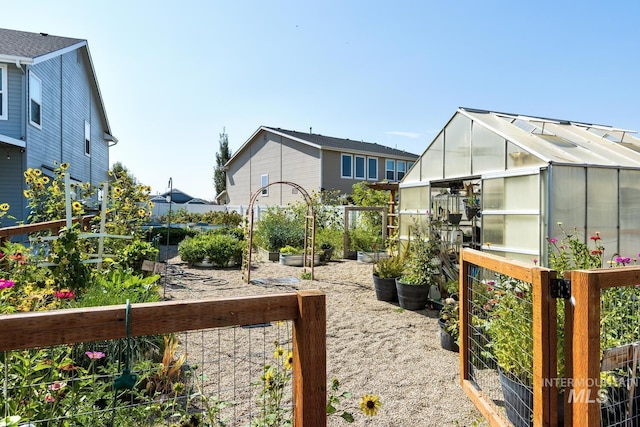 120 Pilgrim Way, Middleton, ID 83644 - view of yard with a vegetable garden, a greenhouse, and an outbuilding