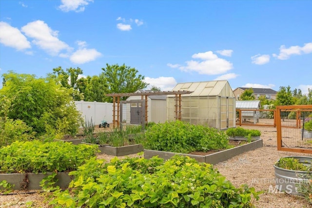 120 Pilgrim Way, Middleton, ID 83644 - view of yard featuring a vegetable garden, a greenhouse, and an outbuilding