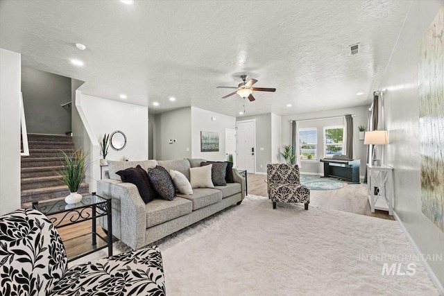 120 Pilgrim Way, Middleton, ID 83644 - living area with wood finished floors, a textured ceiling, stairway, a ceiling fan, and recessed lighting