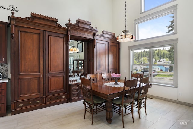 110 S 3rd Ave, Pierce, ID 83546 - dining room with a high ceiling and baseboards