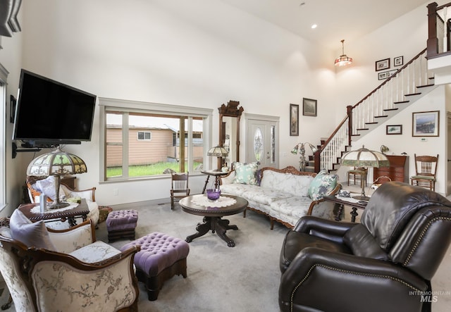 110 S 3rd Ave, Pierce, ID 83546 - carpeted living room featuring a towering ceiling, stairway, baseboards, and recessed lighting