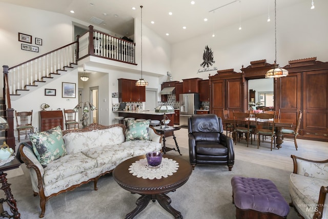 110 S 3rd Ave, Pierce, ID 83546 - living room with a high ceiling, stairway, recessed lighting, and light carpet