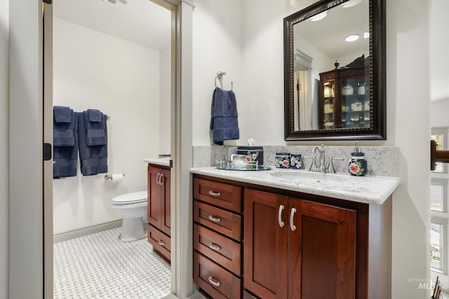 110 S 3rd Ave, Pierce, ID 83546 - bathroom featuring vanity, toilet, and backsplash