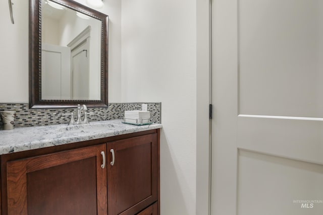 110 S 3rd Ave, Pierce, ID 83546 - bathroom featuring vanity and tasteful backsplash