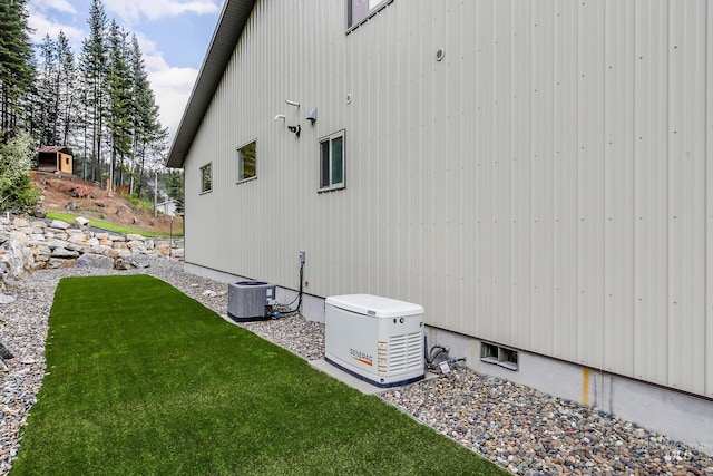 110 S 3rd Ave, Pierce, ID 83546 - view of property exterior featuring central AC and a lawn